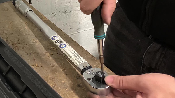 Screw in the 2 screws to hold the plate in place
