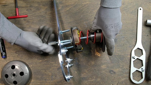 How do I remove the thrust spring?